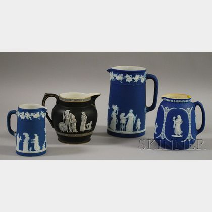 Three Wedgwood Dark Blue Jasper Dip Jugs and a Pratt Fenton Old Greek Pattern Ceramic Jug. 