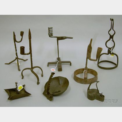 Eight Early Wrought Iron Lighting Devices