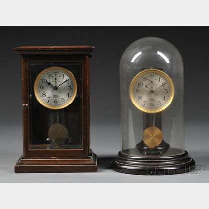 Two Poole Electric Clocks