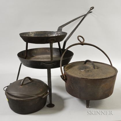 Two Cast Iron Covered Kettles and Two Tripod Pans. Estimate $200-300