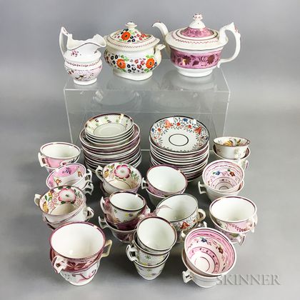 Approximately Sixty-two Pieces of Floral-decorated Pink Lustre Teaware. Estimate $200-300