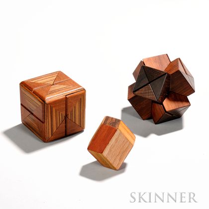 Stewart T. Coffin (American, b. 1931) Three Wooden Puzzles: Diagonal Cube, c. 1971-1985, design no. 58, zebrawood and teak, ht. 3 in.;