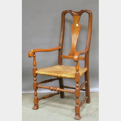 Stickley Queen Anne-style Cherry and Tiger Maple Armchair with Woven Rush Seat. 