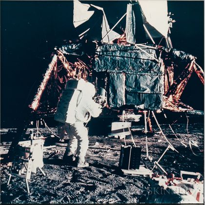 Apollo 12, Astronaut Alan L. Bean Unpacking Experiments at the Lunar Module (NASA AS12-46-6787),November 19, 1969.