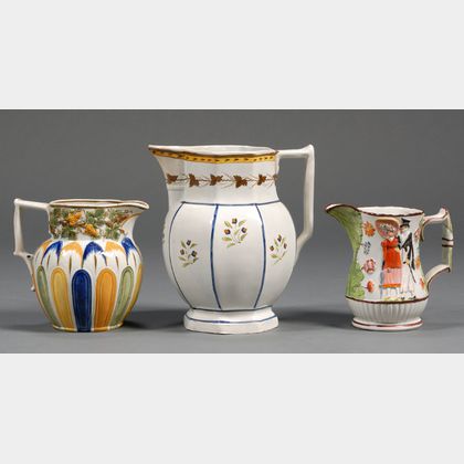 Three Decorated Earthenware Pitchers