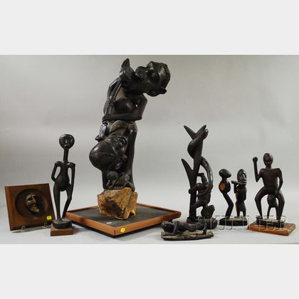 Six Contemporary Carved Wooden African Sculptures and a Wall Plaque