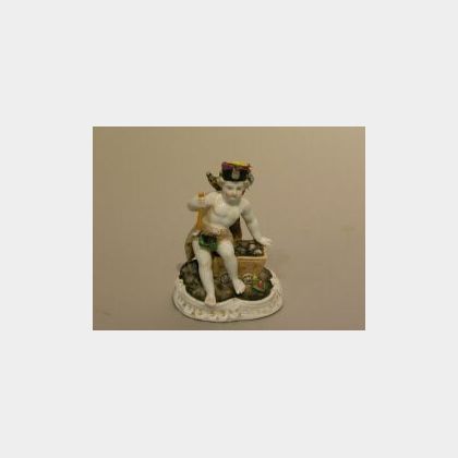 German Porcelain Figure of a Putto in Mining Equipment. 