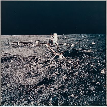 Apollo 12, Astronaut Charles Conrad Jr. Aligns the Antenna on the Central Station of the Apollo Lunar Surface Experiments Package... 