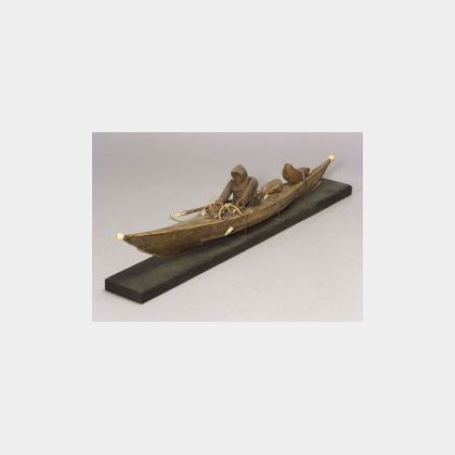 Inuit Hide and Wood Kayak with Paddler