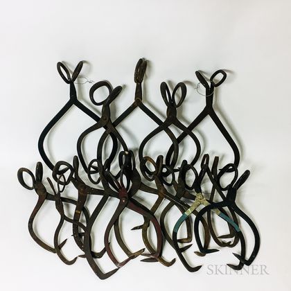 Approximately Fifteen Pairs of Iron Ice Tongs.
