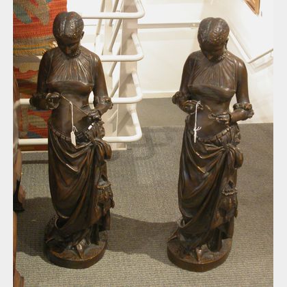 Two Matching Bronze Figures of Women