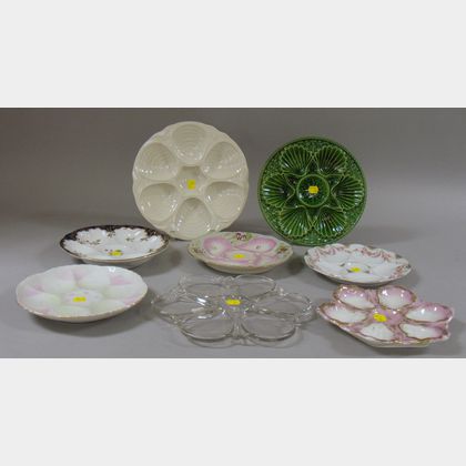 Six Ceramic Oyster Plates and a Colorless Pressed Glass Oyster Plate