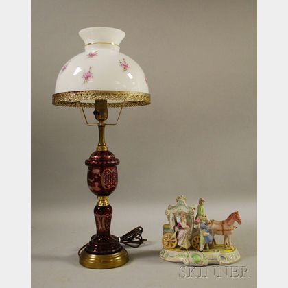 Bohemian Etched Ruby Flash Table Lamp and a Ceramic Figural Group