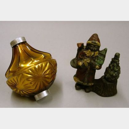 Amber Mercury Glass Ornament and a Painted Cast Metal Santa Claus Figural. 