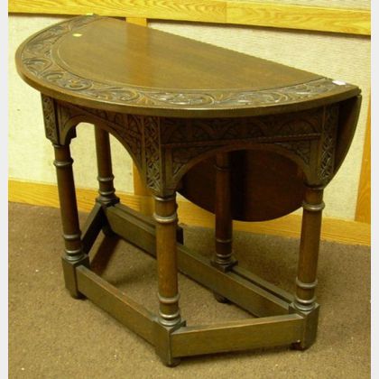Jacobean-style Carved Oak Demilune Drop-leaf Gate-leg Side Table. 