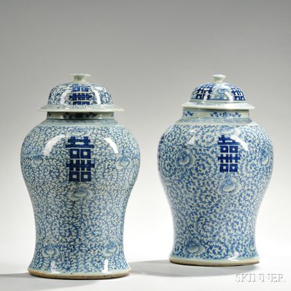 Near Pair of Blue and White Covered Jars