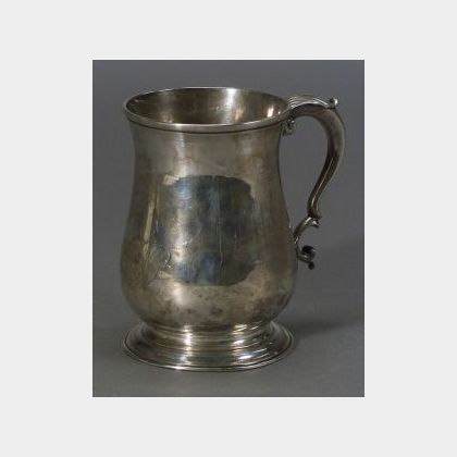 George II Silver Mug. balustroid, with scroll handle topped by leaftip, on spreading foot, monogrammed, ht. 5 in., approx. 10 troy oz. 