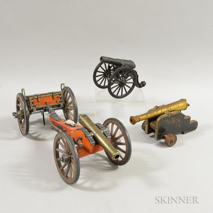 Three Metal and Wood Toy Cannons. Estimate $20-200
