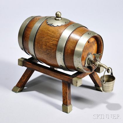 Small Oak Cask on Stand, England, early 20th century, the barrel, cork top, and canted stand mounted with brass, the cask lined and wit