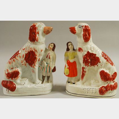 Pair of English Staffordshire Seated Spaniels Figures with Boy and Girl