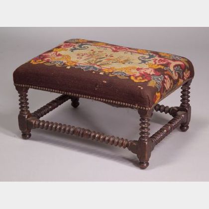 William & Mary Style Needlepoint Upholstered Walnut Spool-turned Footstool. 