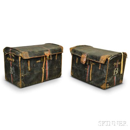 Two Leather-covered Dome-top Wicker Trunks.