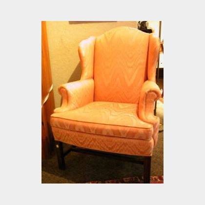 Chippendale-style Upholstered Mahogany Wing Chair. 