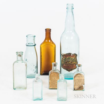 Group of Embossed and Labelled Bottles