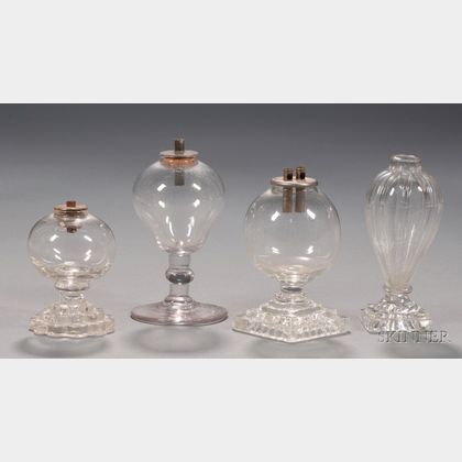 Four Small Colorless Blown Glass Fluid Lamps