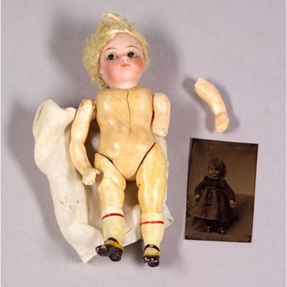 Small Closed Mouth Bisque Head Doll and a Tintype of a Doll