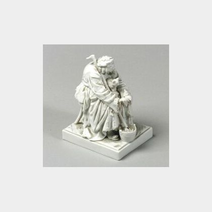 Continental Blanc de Chine Porcelain Figure of a Beggar Woman with Cats