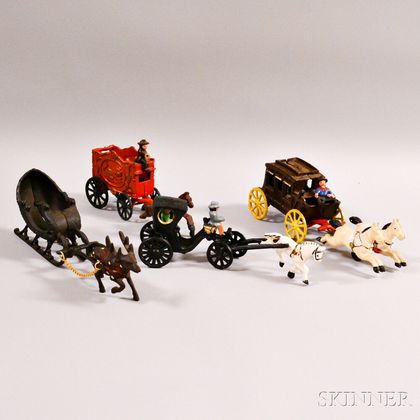 Three Painted Cast Iron Wagons and a Sleigh with Reindeer