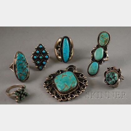 Six Southwestern Silver and Turquoise Rings and a Pendant. 