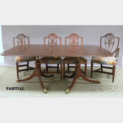 Georgian-style Mahogany Double-pedestal Dining Table and a Set of Twelve Upholstered Carved Mahogany Dining Chairs