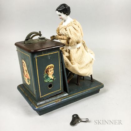 Mechanical China Shoulder Head Doll at a Sewing Machine