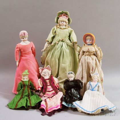 Seven Bisque Bonnet Head Dolls