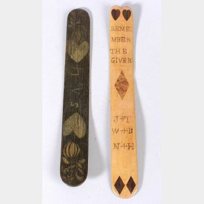 Two Decorated Wooden Busks