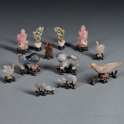 Twelve Miniature Stone Carvings on Wood Stands