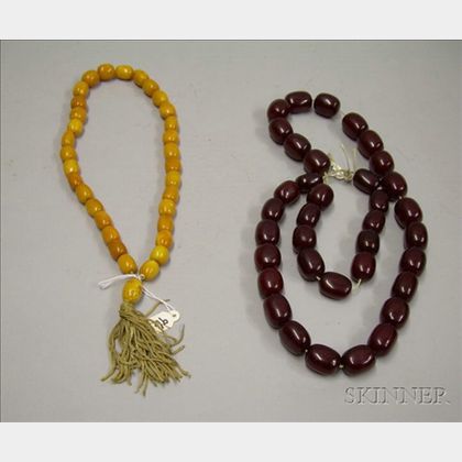 Two Strings of Amber Beads. 