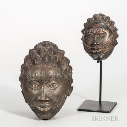Two Bronze Female Masks
