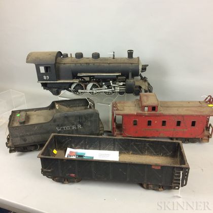 Large Scale Buddy L. Pressed Steel Engine, Tender, Car, Caboose, and Tracks. Estimate $400-600