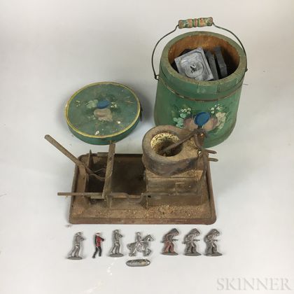 Small Group of Lead Soldiers, Molds, a Melting Pot, and a Miniature Paint-decorated Bucket. Estimate $100-200
