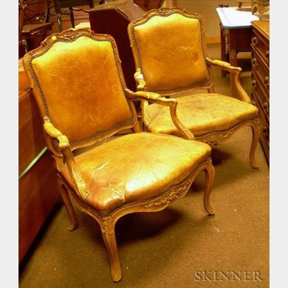 Pair of Louis XV Style Leather Upholstered Carved Beechwood Armchairs. 