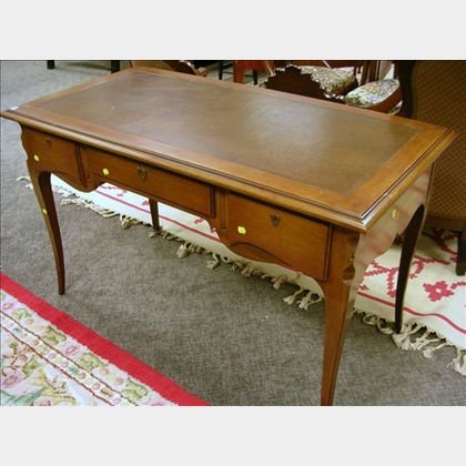 Provincial Louis XV Style Leather-inset Cherry Writing Table. 