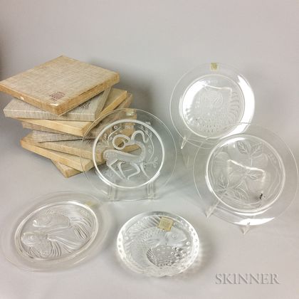 Eight Boxed Lalique Annual Plates and a Fish Plate. Estimate $300-500
