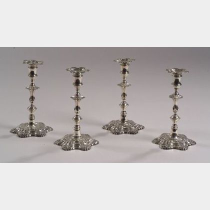 Four George III Rococo Sterling Silver Candlesticks