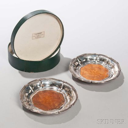 Pair of Dutch .934 Silver-mounted Wine Coasters, Amsterdam, c. 1853, makers mark WH, with a burlwood base, dia. 6 1/2 in. 