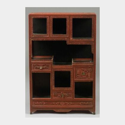 Curio Cabinet, China, 19th century, surface of carved cinnabar lacquer, (loss),24 x 15 x 6 in. 
