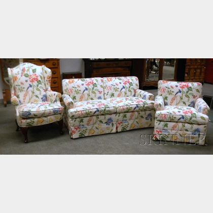 Floral Cotton Upholstered Settee, Armchair, and Queen Anne Style Wing Chair. Estimate $300-400