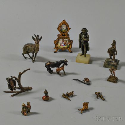 Twelve Miniature European Bronze Figures and an Enameled Miniature Clock. Estimate $300-500